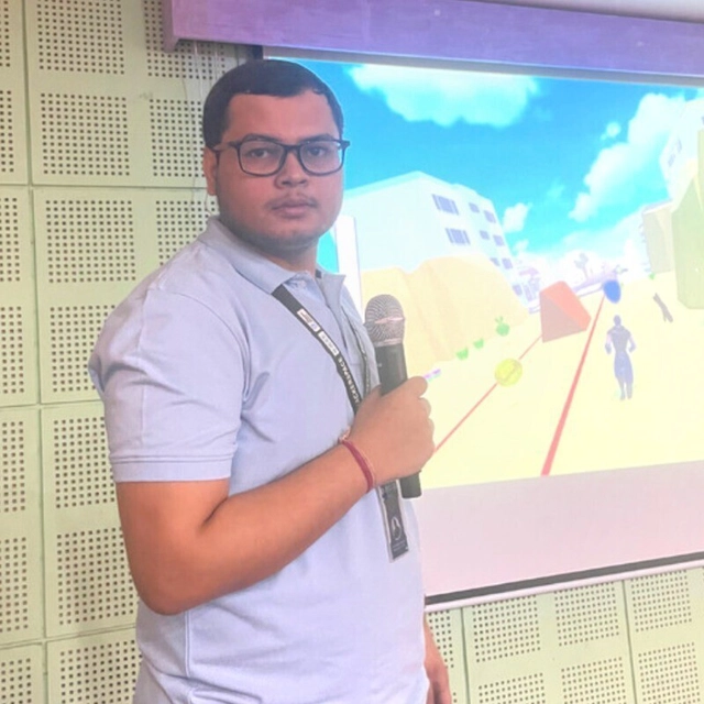 Priyanshu Rauth presenting with a microphone
